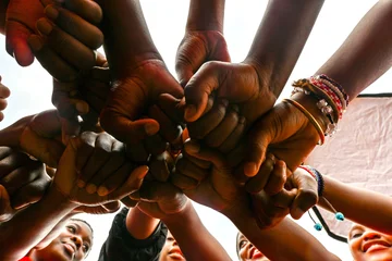 Children's hands locked in circle