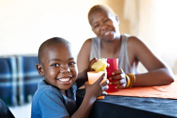 Child smiling sitting with mom